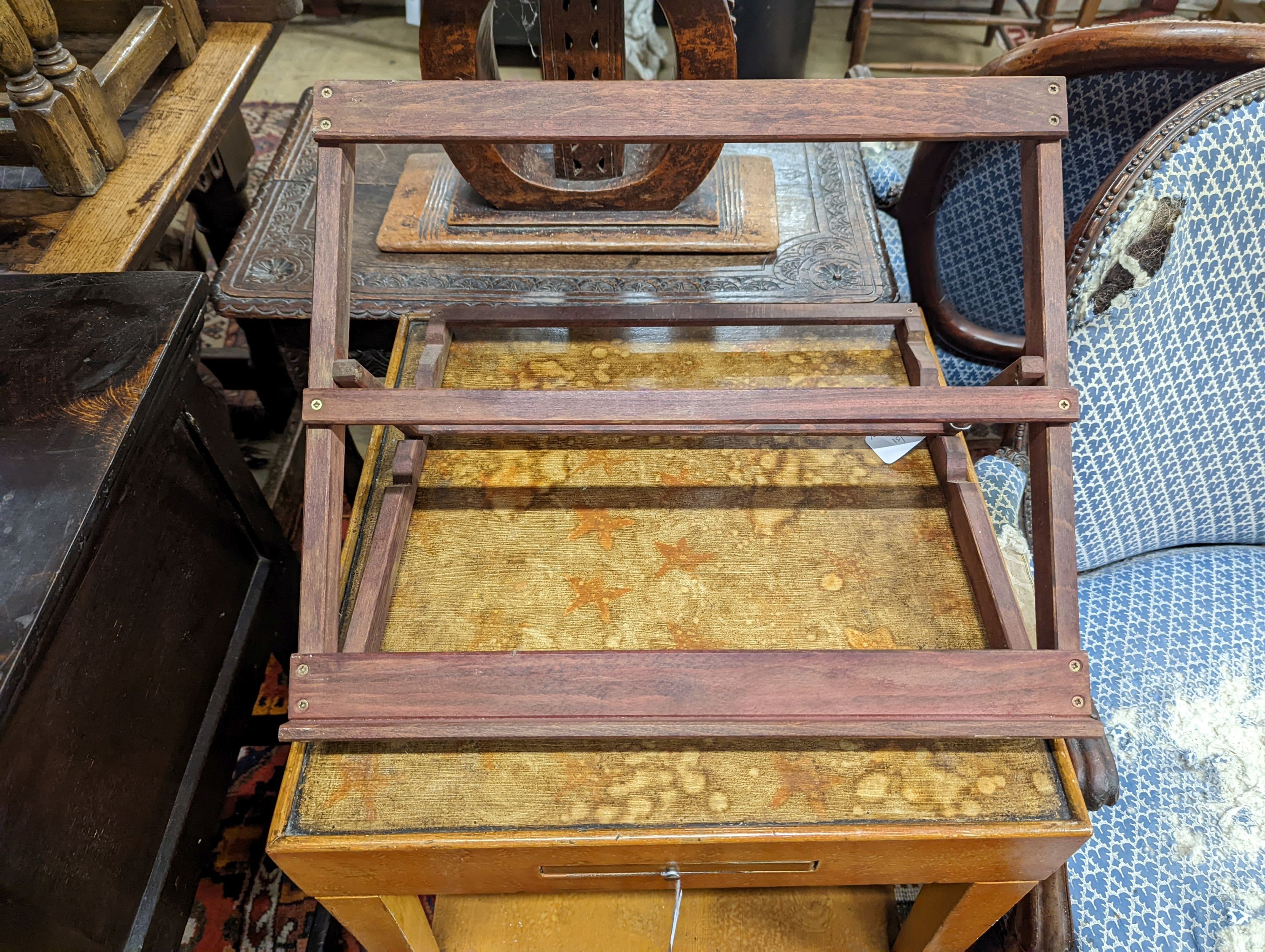 A 20th century two-tier table with scumbled finish, width 51cm, depth 51cm, height 68cm together with a table top adjustable easel